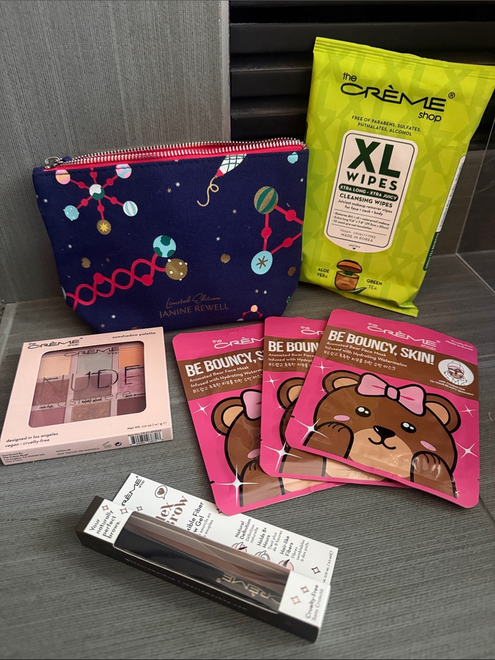 Janine Rewell Navy Cosmetic Pouch with the creme shop cosmetics bundle